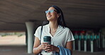 Woman, walking and employee thinking with coffee, commute and travel with smile under bridge. Urban, city and happy professional with hot drink and idea ready to start job with confidence outdoor