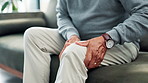 Leg pain, arthritis and couch with elderly person with osteoporosis and stress in retirement home. Problem, massage and muscle sore from joint issue and fibromyalgia on a sofa with injury and lounge