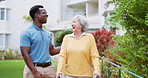 Nursing home, garden and black man with elderly woman, conversation and medical with sunshine. Old person, pensioner and caregiver with nature or environment with summer and funny with humor or laugh