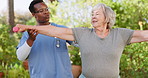 Senior care, weightlifting for exercise and physio, old woman and caregiver in garden with rehabilitation and healing. Breathing, help and muscle training for physical therapy outdoor at nursing home