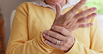 Senior woman, wrist or hands with pain, injury closeup or orthopedic issue at home alone. Tendinitis, elderly person or ache for arthritis, fibromyalgia or osteoporosis of joint and carpal tunnel
