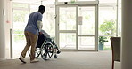Man, physiotherapist and elderly care with wheelchair in trust, support or healthcare at old age facility. Nurse or practitioner helping and walking person with a disability to the door at hospital
