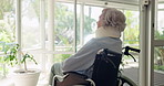 Senior woman, wheelchair and thinking with dream by window for ambition, memory or vision in retirement home. Rear view of elderly female in wonder, thought or person with a disability by glass wall