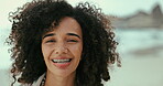 Face, smile and woman on beach in summer for travel, holiday or vacation on tropical coast. Portrait, relax and happy young tourist on island by ocean or sea for fresh air and weekend getaway
