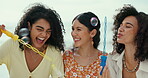 Women, friends or blowing bubbles on beach for a fun holiday vacation for memory on trip together. Smile, laughing or happy people at sea for wellness, support or playful games with love, joy or care