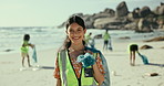 Portrait, beach and woman with a trash bag, recycle and smile with plastic collection and environment. Face, people or group with girl or volunteer with sustainability and ecology with climate change