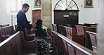 Senior woman, flowers and funeral at chapel with wheelchair, man and burial ceremony. Family, grief and help person with a disability in church for memorial service, death or mourning with bouquet