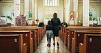 Family, church and catholic for funeral, walking isle and sunday service for condolences and death. Mom, daughter and benches at cathedral, synagogue and back view for chapel and sad farewell 