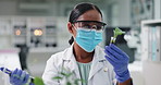 Science, mask and woman with plants in test tube in laboratory for research, safety and medical engineering. Biotech, botany and leaves in glass, scientist or lab technician in checking agro study