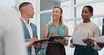 Collaboration, documents and technology with team of business people in office for discussion or planning. Diversity, strategy and teamwork with man and woman employee group talking in workplace