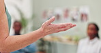 Woman, hands and presentation with team for meeting, staff training or coaching at office. Closeup of female person, spokesperson or presenter talking to group or employees for discussion or speech