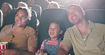 Cinema, watching movie and happy family eating popcorn together with kid, mother and father laughing. Audience, snack and girl child at theater with parents for funny film, comedy or entertainment