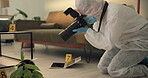 Csi, photographer and evidence at crime scene for investigation of house burglary or murder analysis. Forensic, person and digital pictures in hazmat for observation, examination and case research