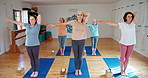 Senior woman, yoga and stretching with group in pilates for zen, spiritual wellness or balance together. Elderly people, yogi or coaching in fitness exercise for warm up, awareness or health on mat