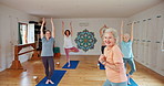 Senior woman, coach and stretching with yoga class for zen, spiritual wellness or balance together. Elderly people, yogi or group with smile for fitness, exercise or pilates in health and awareness