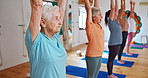 Senior woman, pilates and yoga class with prayer hands in zen, spiritual wellness or balance together. Elderly people, yogi and coach stretching for fitness, awareness or indoor exercise on mat