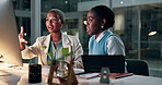 Business women, talking and computer at night in office, collaboration and online research for creative project. Black people, diversity and teamwork as journalist and editing a article for company