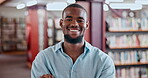 Face, education or black man in a library with arms crossed or smile in college for knowledge or future learning. Scholarship, portrait or happy student at school studying information or research