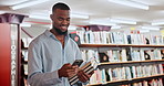 Walking, education or black man in a library with phone for knowledge or development for learning. Social media, happy or student at school studying course info to search on online blog or web news