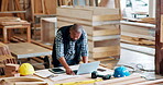 Black man, architect and workplace with laptop in desk for building plan, ideas and design. Mature person, technology  and engineer in warehouse or startup business for construction project.