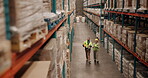 Distribution, logistics and stock with warehouse team walking together to check supply chain storage. Delivery, product or shelves with man and woman in factory for collaboration on tablet in plant