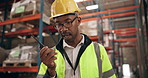 Black man, engineer and communication with walkie talkie, radio or signal for audio check or recording at warehouse. African male person, technician or contractor talking on mic in logistics at depot