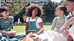 Students, technology and group of friends in park for communication, networking or collaboration on school project. Diversity, academic people and tablet for online learning, education or discussion