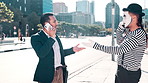 Businessman, smartphone and mime in city with mimic for phone call, discussion or conversation. Male people, angry and technology with stress for argument, fight and digital meeting in Cape Town