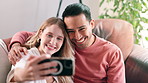 Happy couple, selfie and bonding together with cellphone on couch, profile picture and social media in home. Man, woman and interracial love on mobile for photography for memory and relax on sofa