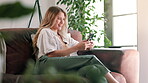 Woman, smile and break with smartphone, relax and rest at home or apartment living room. Lady, window and social media for internet, connectivity and information for happiness on sofa in lounge