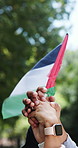People, hands and flag of Palestine with protest for human rights, collaboration and social justice. Friends, diversity and teamwork in park for partnership, support and hope for peace in Gaza