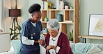 Elderly, woman and caregiver with help or walking stick for mobility, injury healing and retirement support in nursing home. Senior person, nurse and talking with laughing or medical care in homecare