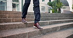 Legs, walking and business person at stairs in city for travel in the morning outdoor. Shoes, commute and professional at steps in urban town for journey, trip and work opportunity for consultant