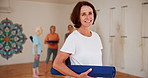 Fitness, yoga and portrait of mature woman in class for health, wellness and exercise with confidence. Smile, workout and happy face of female person in pilates studio for mobility, balance and body