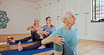 Fitness, yoga and senior women stretching in class for wellness, healthy body and balance on floor. Retirement, pilates and elderly people on sports mat for exercise, workout and training together