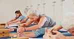 Exercise, yoga and senior women stretching in class for wellness, healthy body and fitness on floor. Retirement, pilates and elderly people on sports mat for flexibility, workout and training in gym