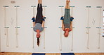 Stretching, women and exercise with rope on wall for yoga or senior person practice iyengar together in gym. Fitness, body health and friends with wellness for wellbeing and flexibility at class