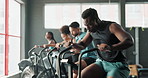 Bike, gym and people with fitness, training and challenge with endurance and cardio with wellness. Health, group and equipment with energy and cycling with increase heart rate or exercise machine