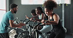 Coach, gym or people on cycling machine for a biking workout or cardio training for endurance. Fitness class, exercise bike or sports woman on bicycle with personal trainer for support or motivation