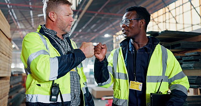 Fist bump, teamwork and men walking in warehouse for construction ...