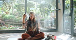 Aromatherapy, smoke and woman with healing ritual for mindfulness, peace and boho culture. Zen, meditation and girl at retreat with alternative medicine for spiritual balance for mind, body and soul.