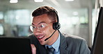 Happy man, consultant and call center with headphones for online advice, support or customer service at office. Young male person, employee agent or virtual assistant consulting with headset for help