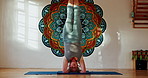 Senior woman, yoga and upside down for flexibility, mindfulness and healthy body in retirement. Elderly person, zen and stretching with headstand for spiritual, chakra and peace in gym studio