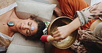 Singing bowl, meditation and woman on floor with healer for sound therapy, vibration or chakra balance from above. Healing, crystal or female person with shaman for energy, cleaning or holistic care