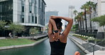 Urban, woman or runner stretching arms for fitness training, wellness or outdoor exercise in city. Bridge, back view or healthy female person in warm up ready to start jog or running workout in Miami