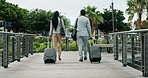 City, walking and business people with suitcase for travel, morning commute and work trip. Corporate, professional and back of man and woman with luggage for global convention, airport and journey