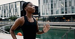 Woman, running and city with lake for exercise workout or cardio performance for health, marathon or preparation. Female person, training and urban promenade for speed endurance, sprinting or fitness