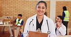 Doctor, clipboard and face of woman with smile for healthcare checklist, schedule and notes in hall. Medical professional, paper and happy with paperwork for information, agenda and community service