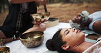 Tibetan, meditation and people with sound of singing bowl for indigenous spiritual healing in holistic practice. Soul, music and relax outdoor to calm vibration of metal instrument in nature with zen