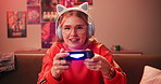 Headphones, face and woman playing video game in house for competition, rpg and online. Controller, girl and person on console technology for entertainment with neon light in portrait at apartment